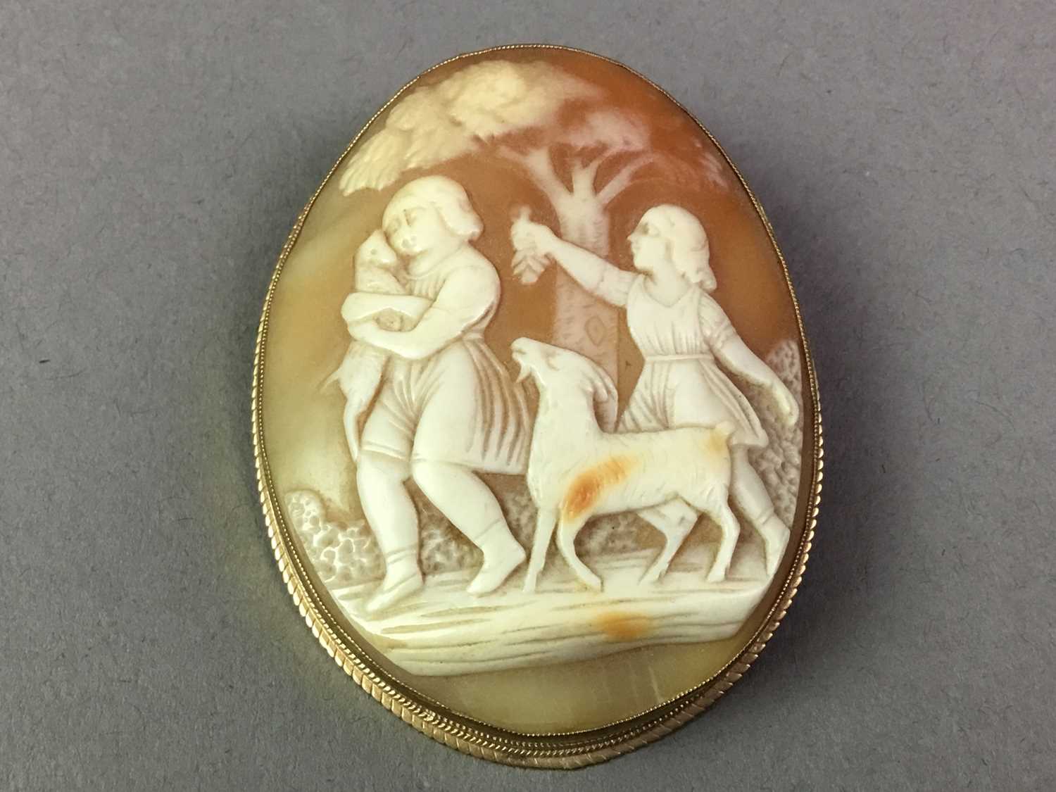 TWO CARVED CAMEO BROOCHES ALONG WITH A SILVER HARDSTONE BROOCH