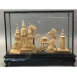 CHINESE CARVED CORK MODEL OF BUILDINGS AMONGST TREES AND OTHER ASIAN ITEMS