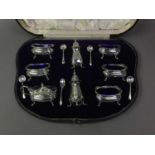 EDWARDIAN SILVER EIGHT PIECE CRUET SET