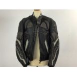 LOOKWELL BLACK LEATHER MOTORCYCLE JACKET ALSO A BLACK HJC MOTORCYCLE HELMET AND A LEVI`S BLACK VINYL