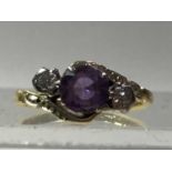 AMETHYST AND DIAMOND THREE STONE CROSSOVER RING, IN EIGHTEEN CARAT GOLD