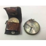 TWO POCKET COMPASSES ALONG WITH COINS AND MEDALS