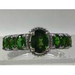 TWO CHROME DIOPSIDE RINGS AND A PAIR OF EARRINGS