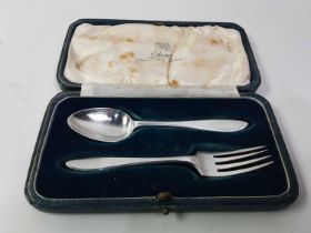 FOUR CASED SETS OF SILVER AND SILVER HANDLED FLATWARE,