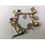 MID-20TH CENTURY CHARM BRACELET,