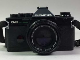 OLYMPUS OM-2 CAMERA, ALONG WITH OTHER ITEMS