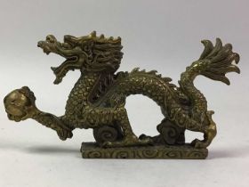 CHINESE BRONZE MODEL OF A DRAGON HOLDING A PEARL AND OTHER BRONZE ITEMS