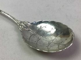 GROUP OF THREE SILVER TEA SPOONS AND A CONTINENTAL SILVER SEVRING SPOON