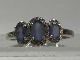 THREE TANZANITE AND DIAMOND RINGS, ALONG WITH ANOTHER DRESS RING