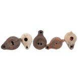 A GROUP OF FIVE ANCIENT ROMAN TERRACOTTA OIL LAMPS
