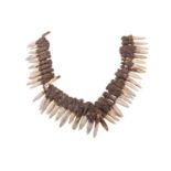 A WEST AFRICAN/PACIFIC ISLANDS TRIBAL TOOTH NECKLACE