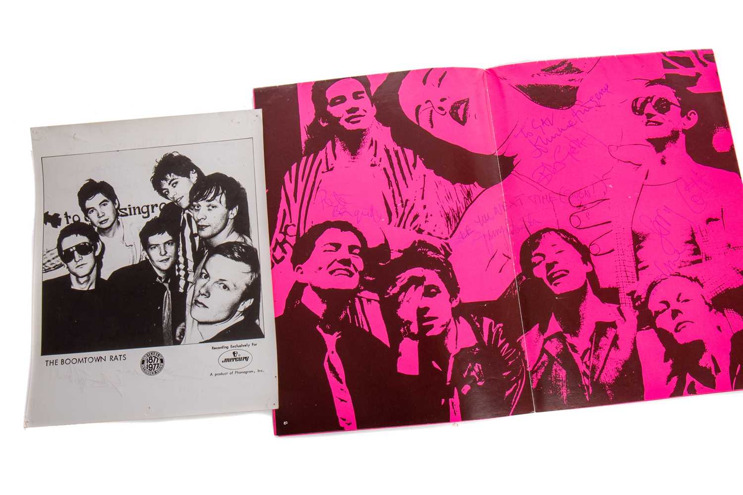 THE BOOMTOWN RATS - SIGNED PHOTOGRAPH AND POSTERGRAMME WITH A DOUBLE-SIDED POSTER