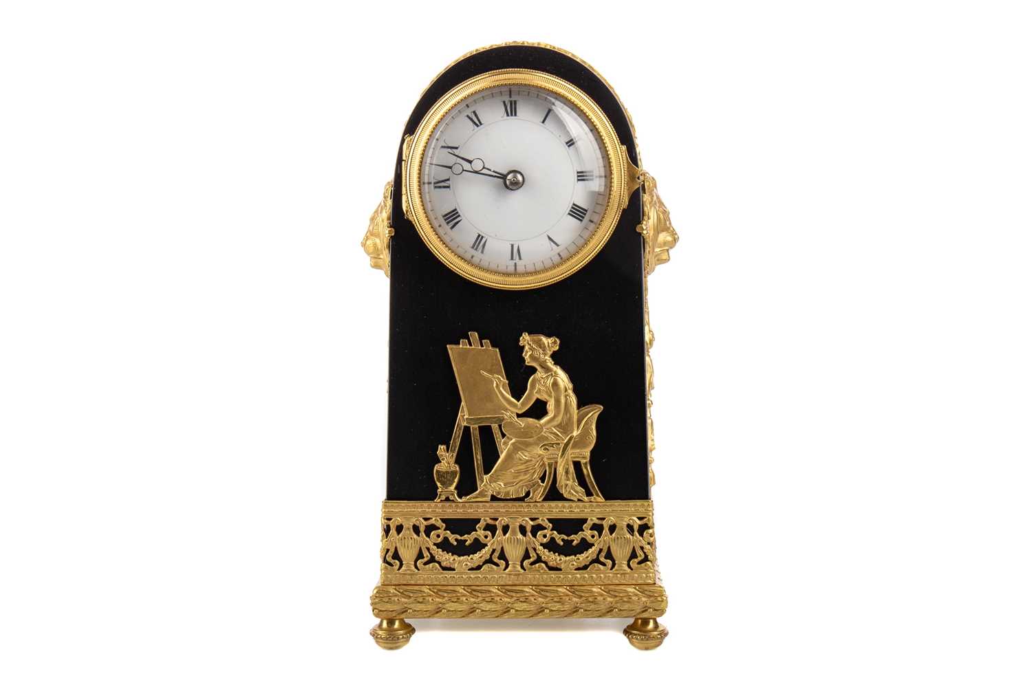 A FRENCH EMPIRE EBONISED DOMED MANTLE CLOCK