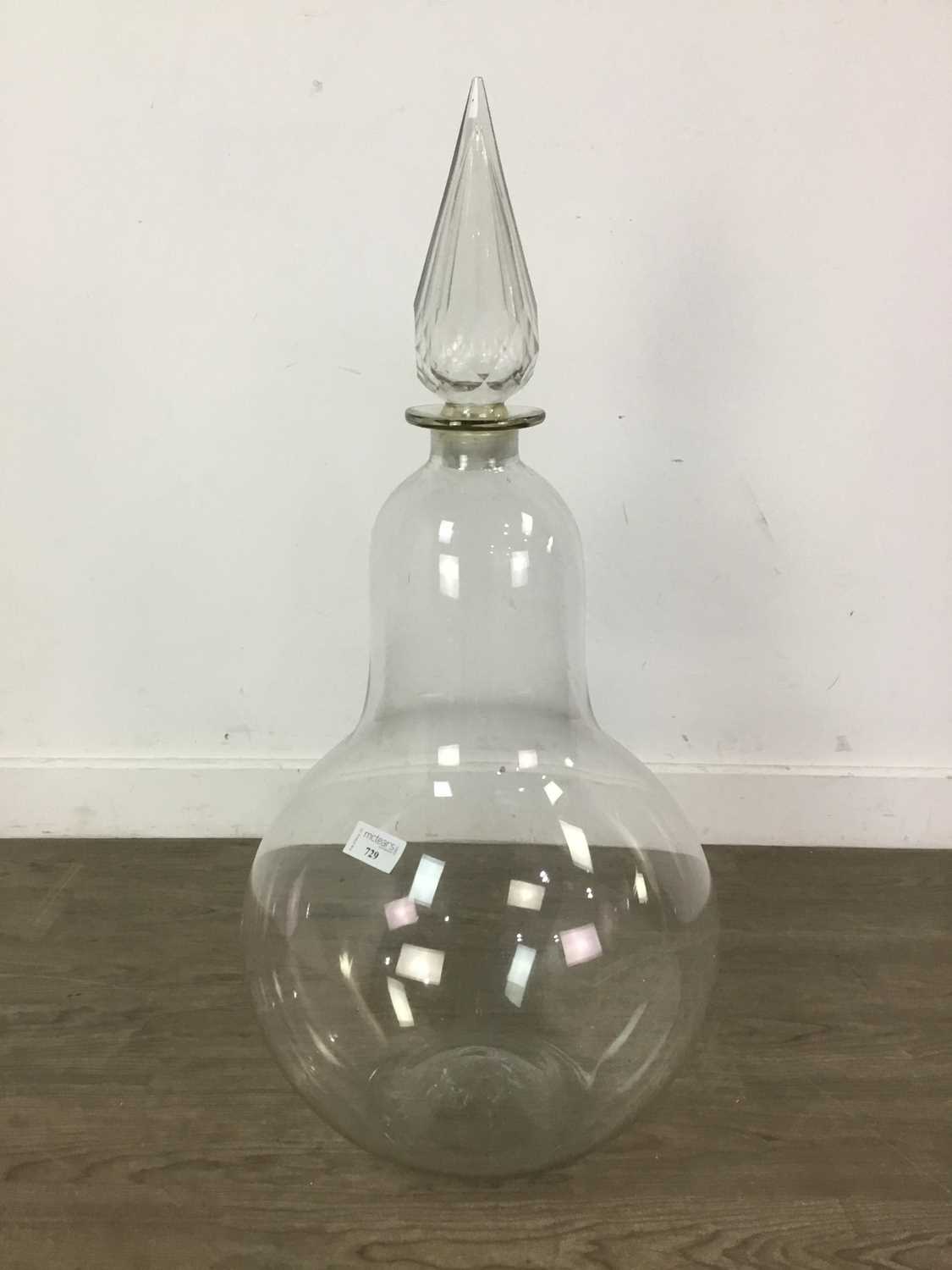 A LARGE VICTORIAN PHARMACIST'S CLEAR GLASS PEAR SHAPED BOTTLE AND STOPPER