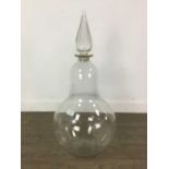 A LARGE VICTORIAN PHARMACIST'S CLEAR GLASS PEAR SHAPED BOTTLE AND STOPPER