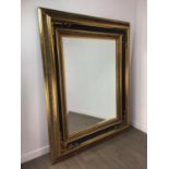 A LARGE CONTEMPORARY GILT AND MOULDED WALL MIRROR