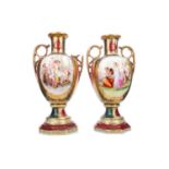 A PAIR OF LATE 19TH/EARLY 20TH CENTURY CONTINENTAL PORCELAIN TWIN HANDLED VASES