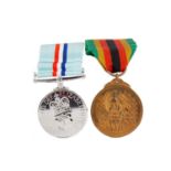 AN ELIZABETH II 1980 RHODESIA MEDAL AND ZIMBABWE INDEPENDENCE MEDAL