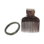 AN AFRICAN IGBO CURRENCY BANGLE AND A TRIBAL WOODEN COMB