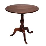 A George III mahogany tripod table, the dished top on turned pillar, 74cm h; 48cm diam and a