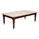 A Victorian servant's hall or kitchen table, the pine top on mahogany base with pottery castors,