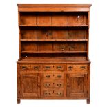 A George III fruitwood and pine dresser, early 19th c, with reeded cornice and three shelf boarded