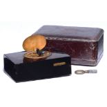 A Swiss tortoiseshell singing bird box, late 19th c, the oval silver lid engraved with birds,