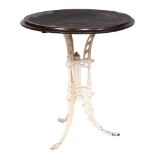 A Victorian cast iron pub table, the round wood top on three decorative incurved legs around central