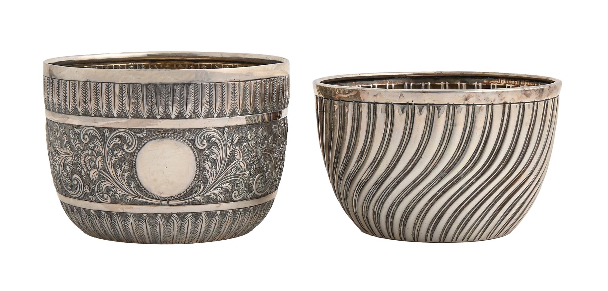 Two Victorian silver sugar bowls,  spirally fluted or chased with scrolling foliage in