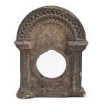 A Victorian carved sandstone fountain head clockcase in the form of a Norman arched doorway, 32cm