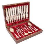 A Victorian EPNS fruit service, including twelve mother of pearl hafted knives and forks, in plush