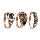 A Victorian garnet ring, in gold, a late Victorian paste ring in 9ct gold and a contemporary 9ct