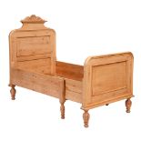 A pine bed, with panelled head and footboard, 94 x 186cm The collection of C. W. Briggs (1906-