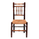 A fruitwood and ash spindle back chair, early 19th c, rush seat, 44cm h The collection of C. W.