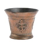 An English decorated bronze mortar, Norwich, late 16th c, cast with the head of Christ within