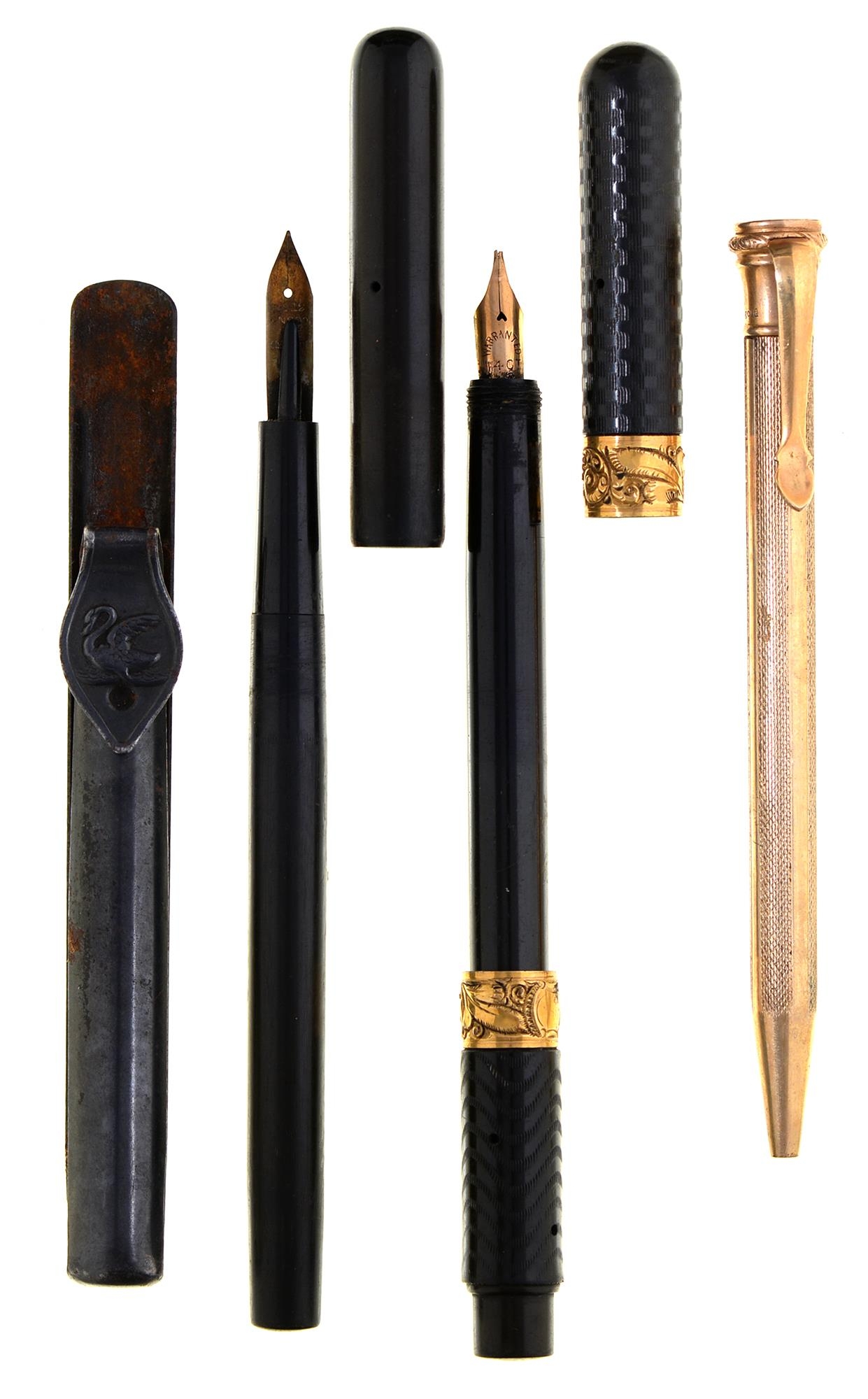 A Moore's non leakable vulcanite fountain pen, engine turned, with two embossed gold collars