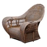 Dryad. An Arts & Crafts wicker armchair, early 20th c, the broad arms with basket or cup holder,