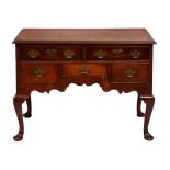 A mahogany and crossbanded lowboy, 19th c, fitted five drawers above the shaped apron, on cabriole