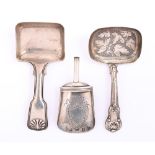 Three silver caddy spoons, comprising a shovel engraved with shield cartouche, lacks handle, 58mm l,