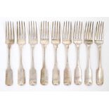A set of nine Irish Victorian silver table forks, Fiddle pattern, crested, by Richard Whitford,