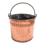 A Victorian riveted copper coal bucket, early 20th c, 32cm h excluding iron handle The collection of