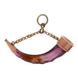 A Victorian copper gilt mounted faceted amethyst glass horn shaped scent bottle, 36mm l The