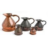Five Victorian graduated copper measures, of haystack type, largest 26cm h The collection of C. W.