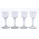 Four English wine glasses, late 18th c, the round funnel bowl on faceted stem, 14.5cm h The