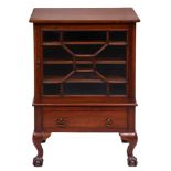 An Edwardian mahogany music cabinet, with glazed door, 83cm h; 43 x 58cm The collection of C. W.