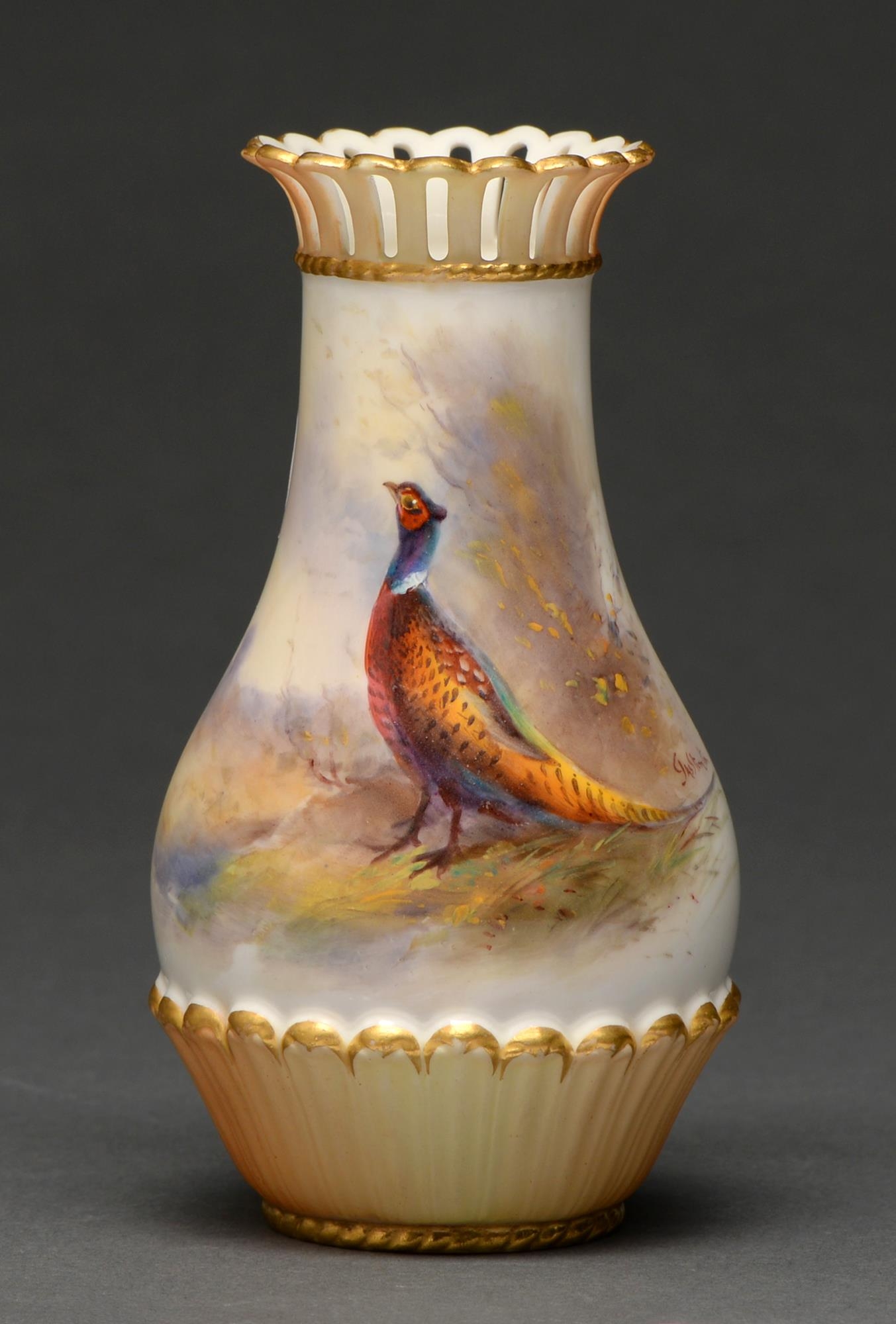 A Royal Worcester vase, 1910, with pierced neck, painted by Jas Stinton, signed, with a pheasant,
