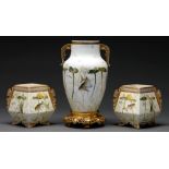 A Staffordshire porcelain garniture, attributed to Moore, c1870, in the form of one and a pair of