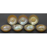 A set of seven iridescent glass dishes, early 20th c Good condition