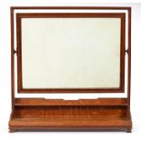 An Arts & Crafts oak dressing mirror, c1930, with moulded surround and rectangular frame, on tray