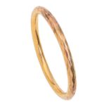 A 9ct gold bangle, engraved XMAS 1920, 70mm diam (internal), Birmingham 1919, 17.5g Worn